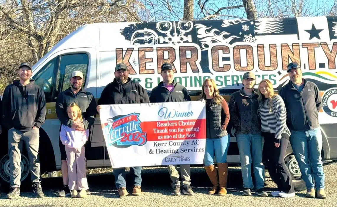 Kerr County A/C & Heating Services team standing in front of their service van.